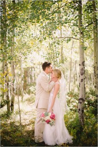 Bride and groom in aspen trees